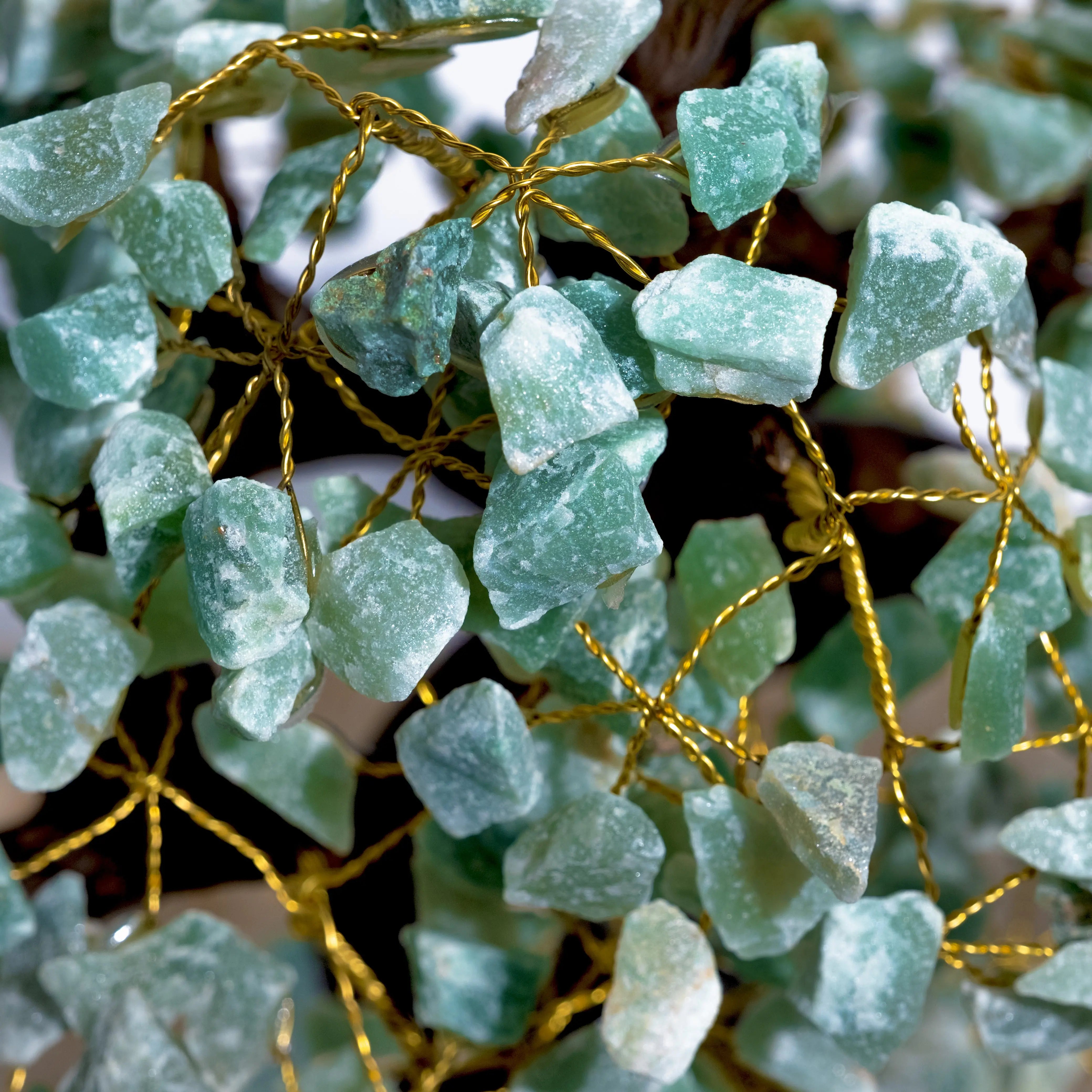 Close-up of handcrafted Aventurine Crystal Bonsai Tree showcasing green crystals and golden wires for prosperity and harmony.