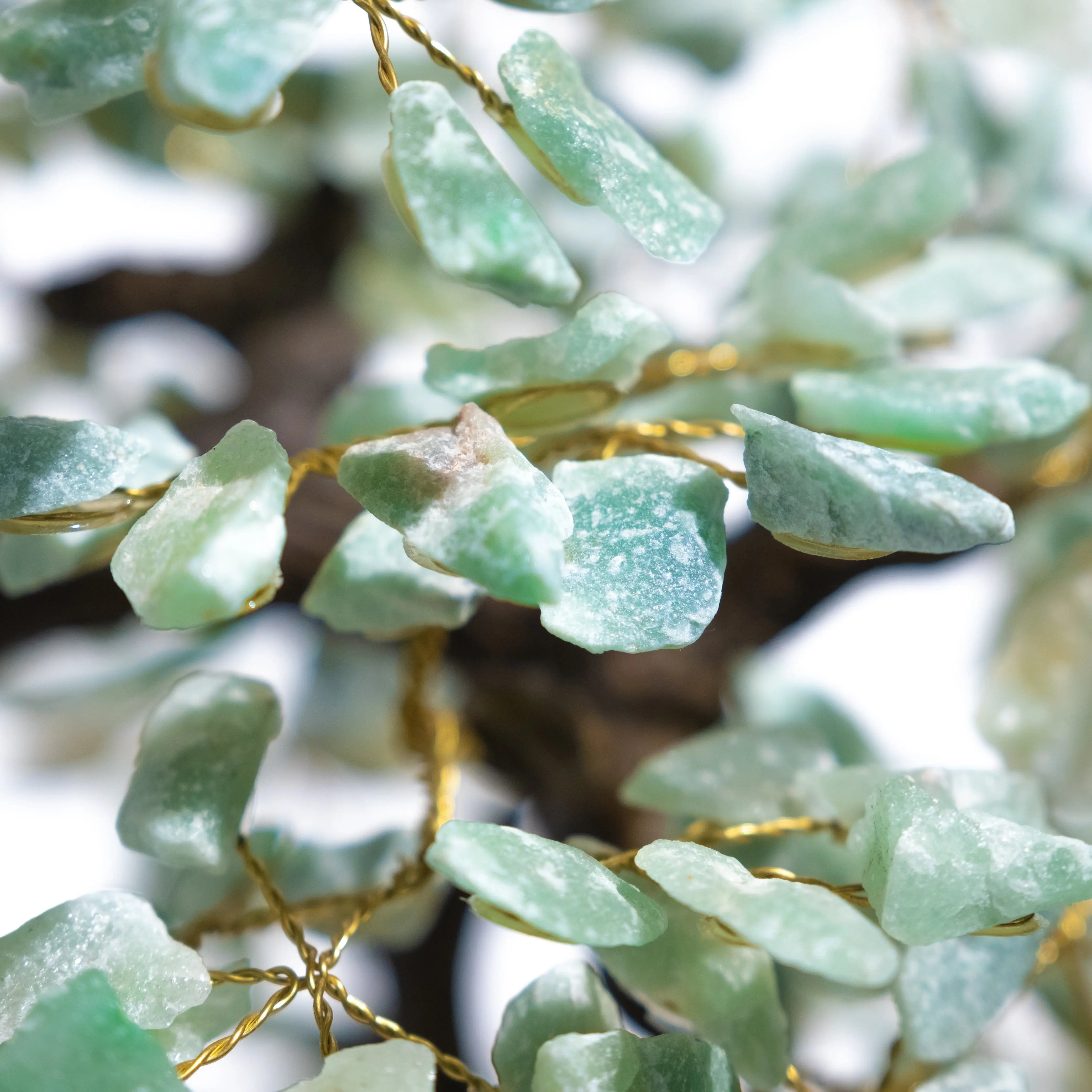 Close-up of rough Aventurine Crystal Bonsai Tree with green stones symbolizing prosperity and abundance, 65 cm tall.