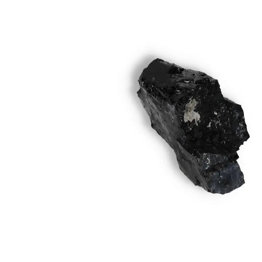 Rough Black Tourmaline Druze L by Sylvia Crystals, known for cleansing negative energies and promoting mental balance.
