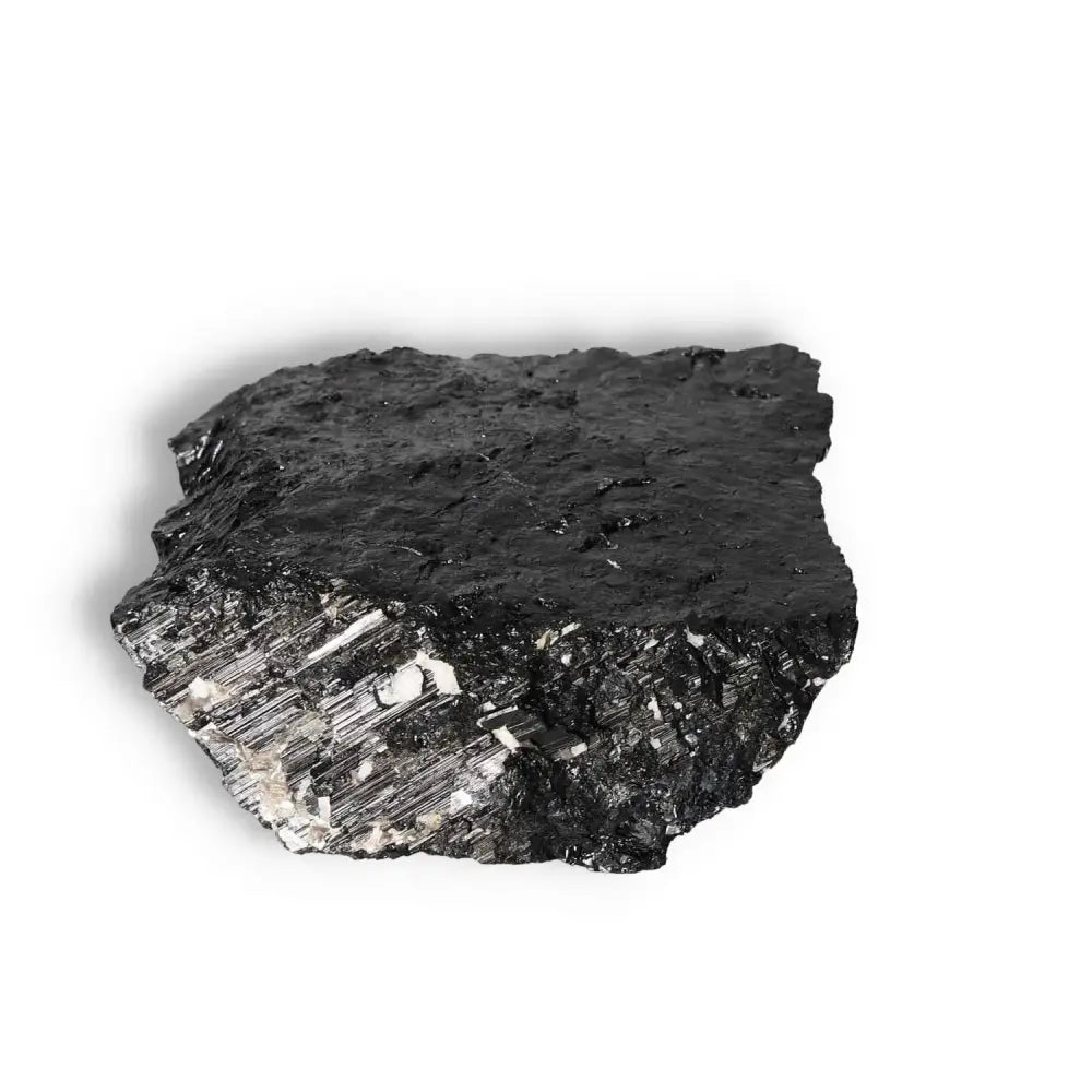 Rough Black Tourmaline Druze crystal from Sylvia Crystals, known for protection and purification, on a white background.