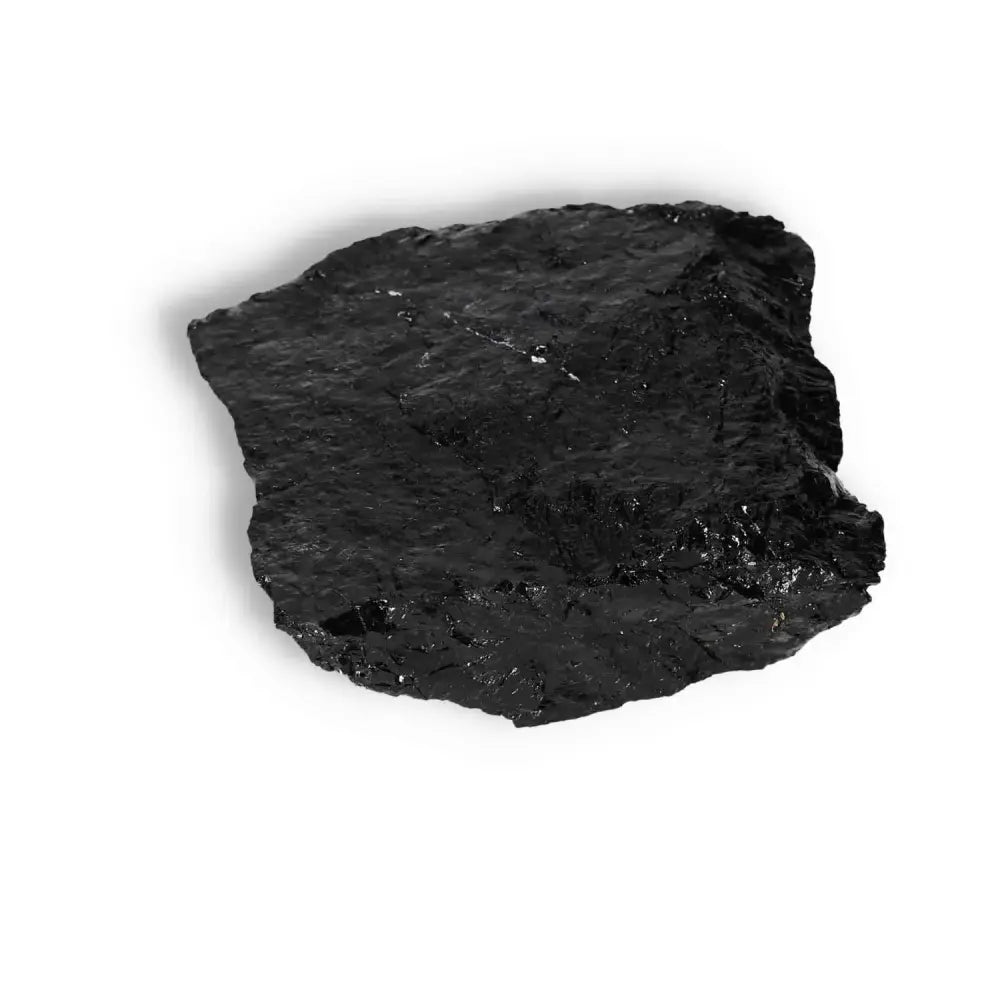 Rough Black Tourmaline Druze crystal, known for protection and purification, from Sylvia Crystals, on a white background.