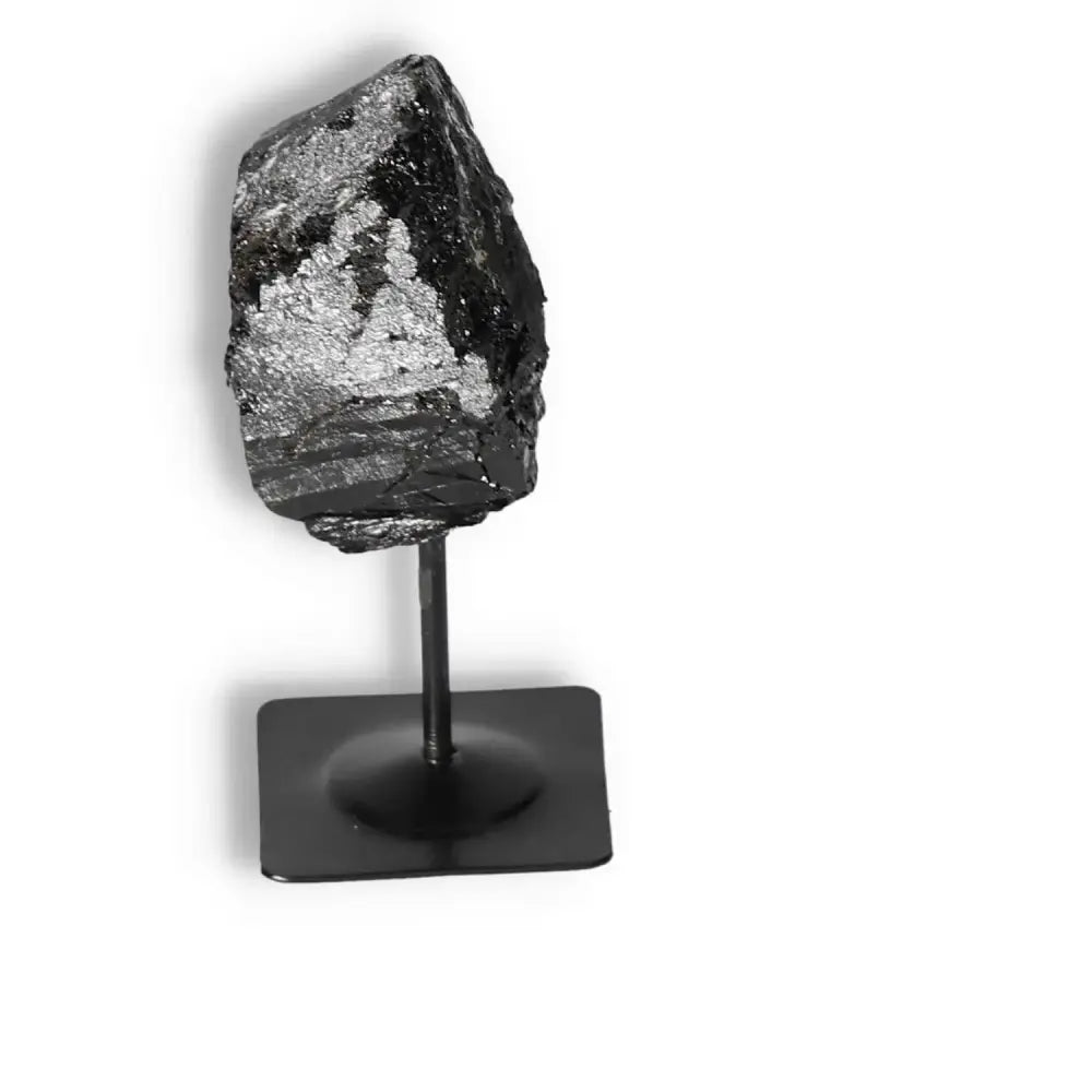 Rough Black Tourmaline on Metal Stand M from Sylvia Crystals, known for its cleansing properties and luxurious design.