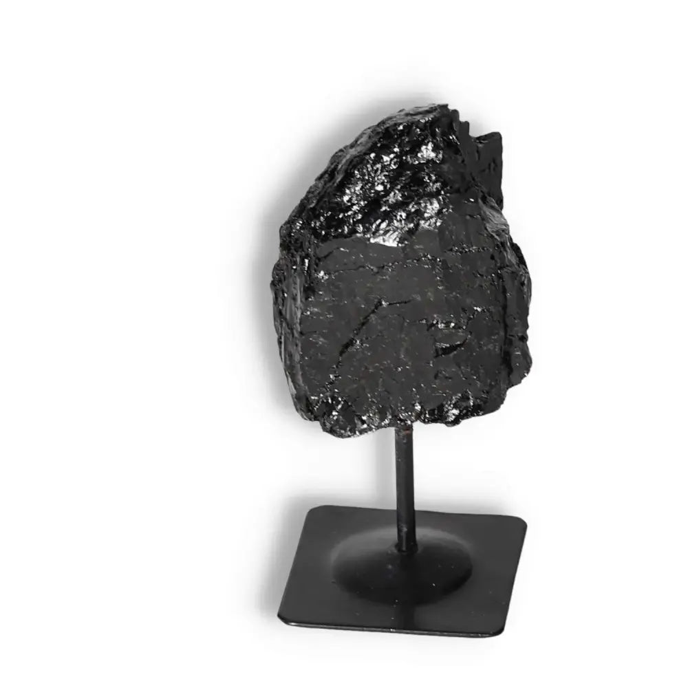 Rough Black Tourmaline with Metal Stand S, cleansing crystal from Sylvia Crystals, ideal for transforming negative energies.