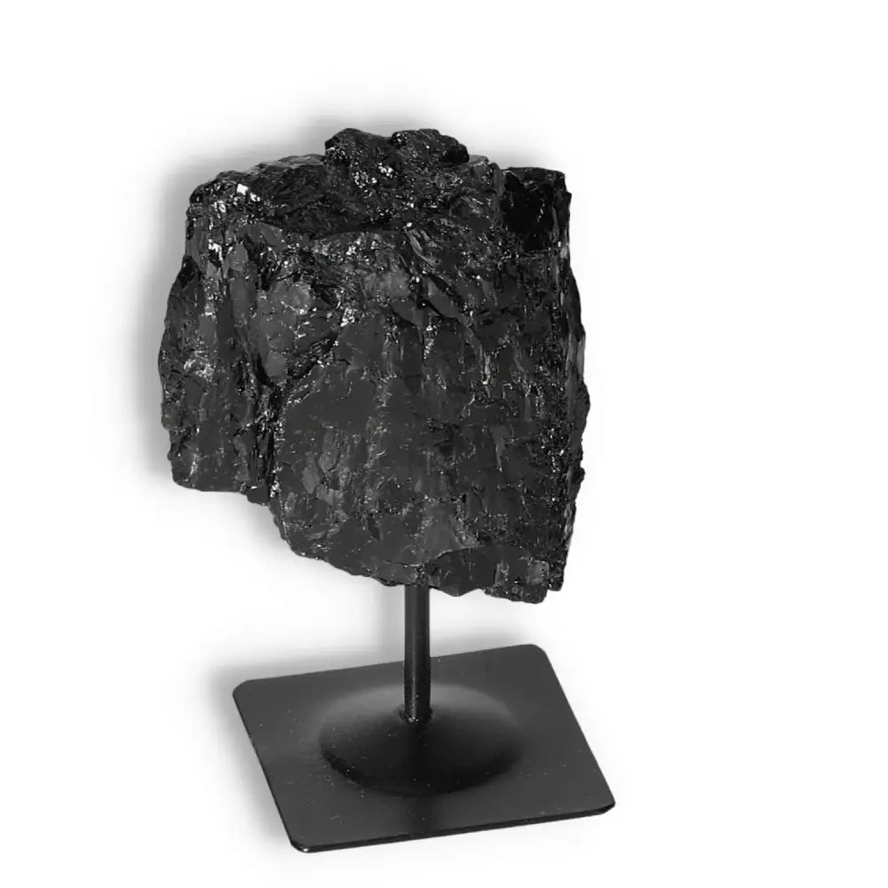 Rough Black Tourmaline with Metal Stand S by Sylvia Crystals, known for cleansing negative energies and emotional healing.