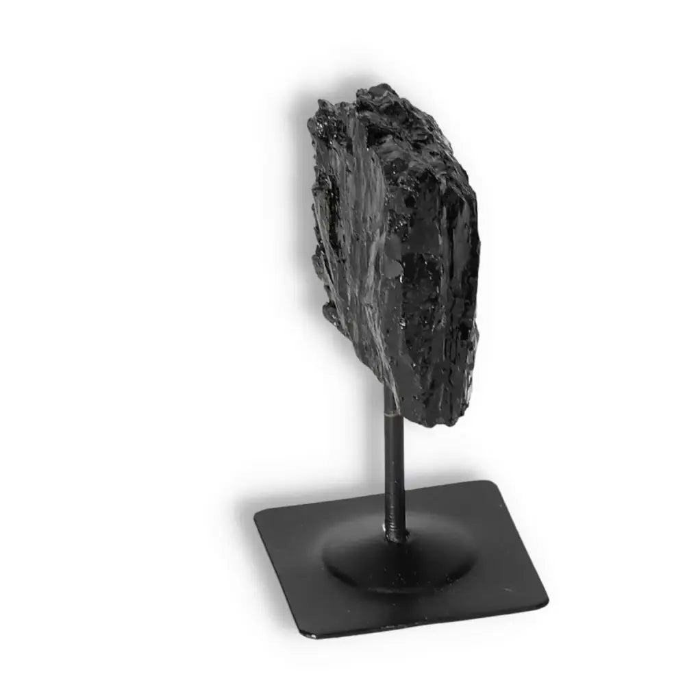 Rough Black Tourmaline with Metal Stand S by Sylvia Crystals, showcasing raw beauty and energy for emotional healing and grounding.