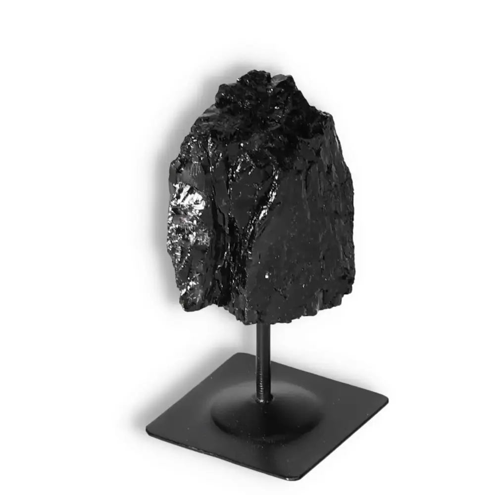 Rough Black Tourmaline with Metal Stand S by Sylvia Crystals, showcasing raw beauty and energy for healing and grounding.