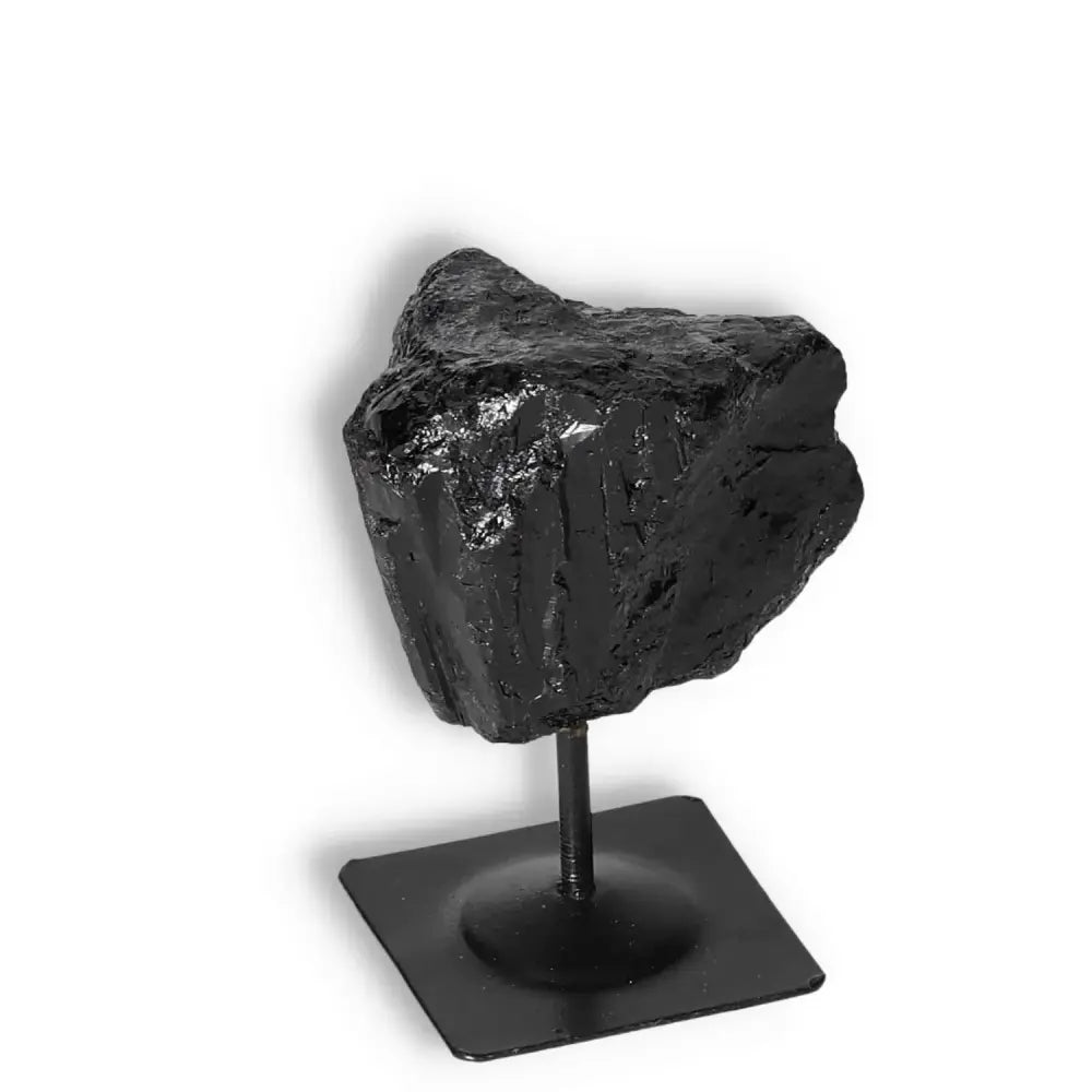 Rough Black Tourmaline with Metal Stand S from Sylvia Crystals, known for energy transformation and protection against radiation.