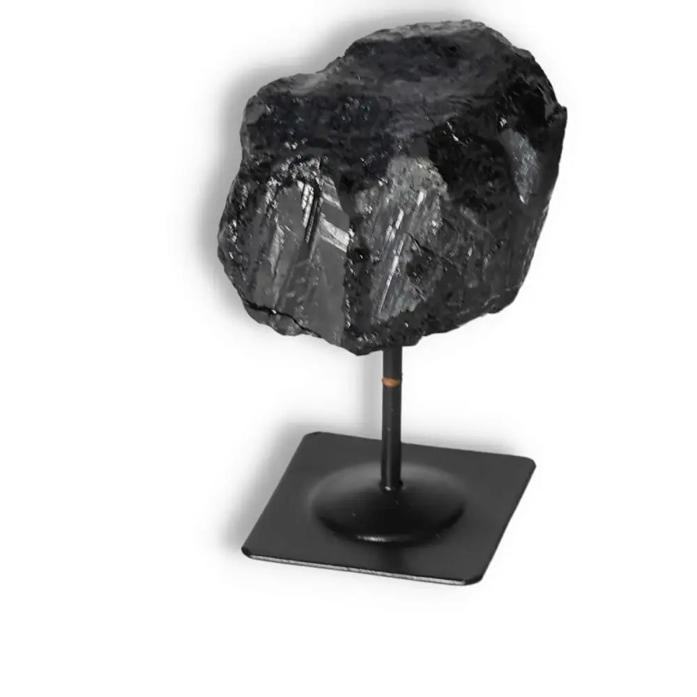 Rough Black Tourmaline with Metal Stand S, showcasing its superior quality and spiritual elegance, available at Sylvia Crystals.