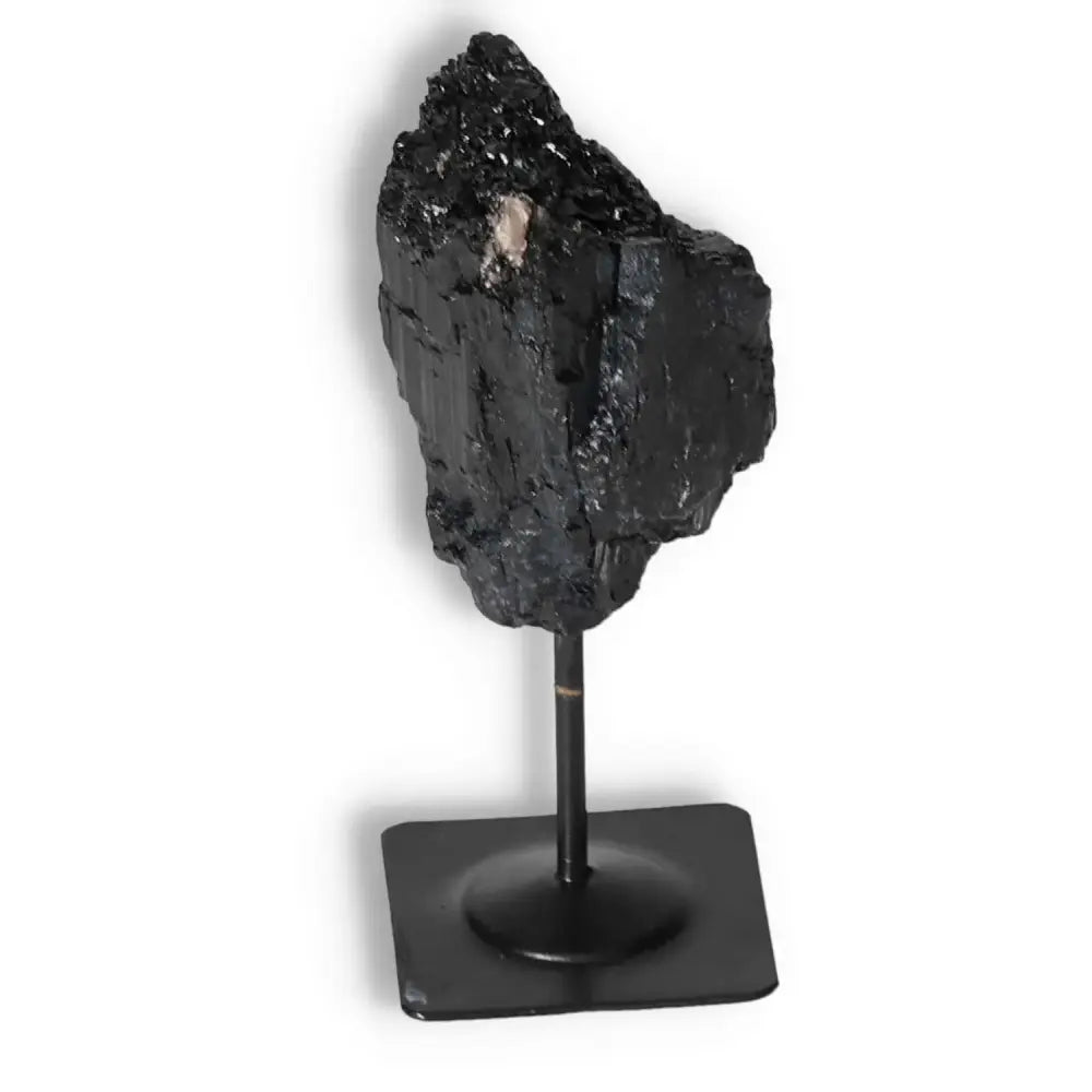 Rough Black Tourmaline on Metal Stand by Sylvia Crystals, ideal for balance and positivity in luxury environments.