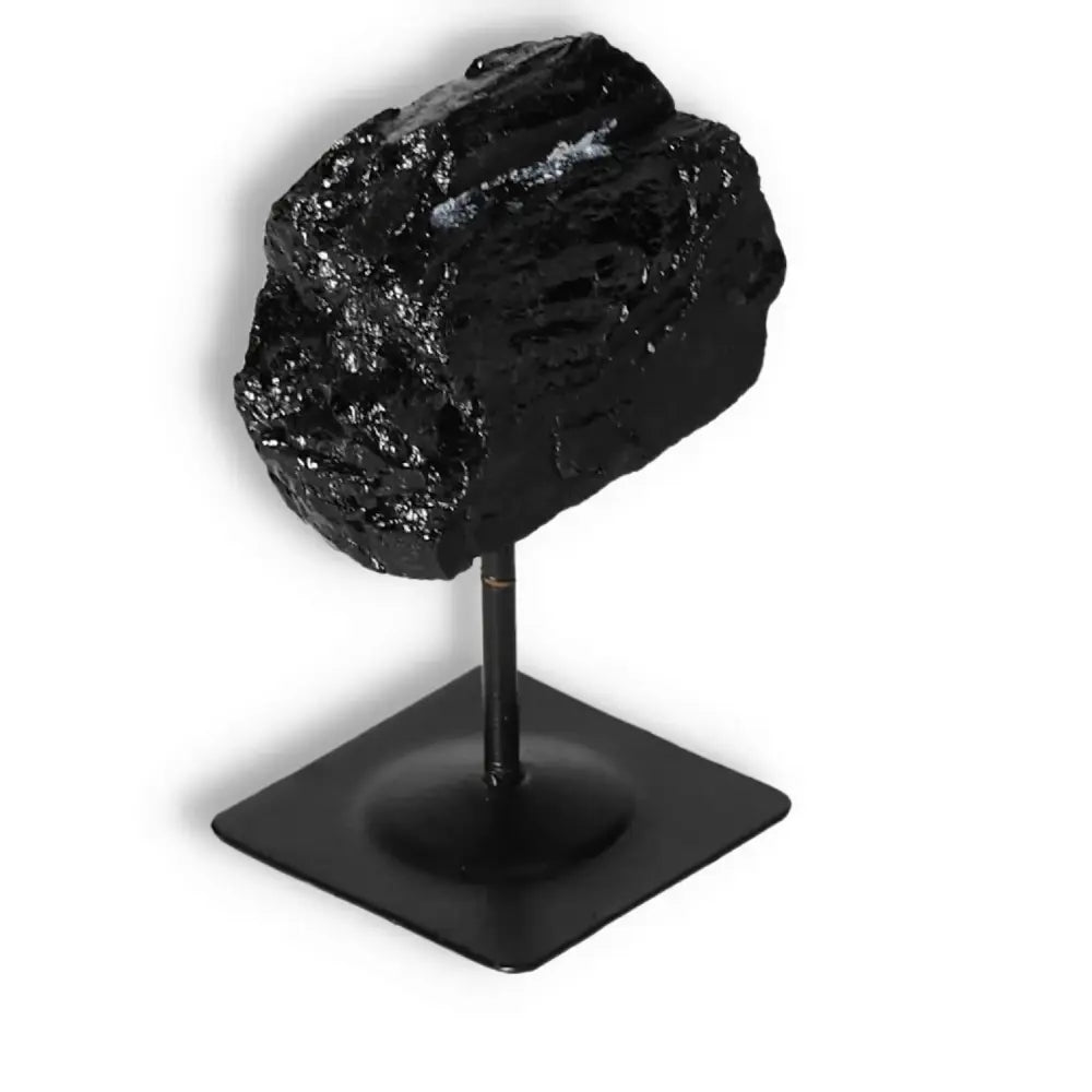 Rough Black Tourmaline with Metal Stand S by Sylvia Crystals, perfect for cleansing negative energies and enhancing luxury interiors.
