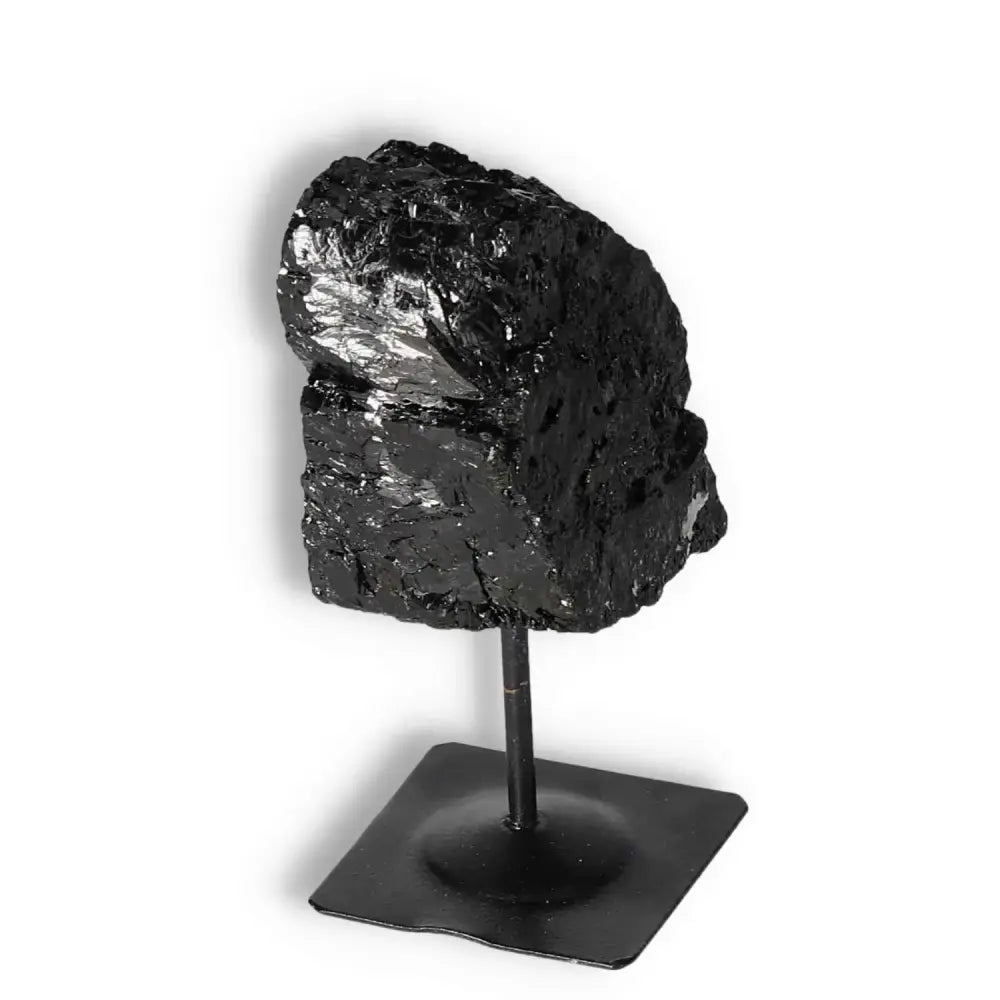 Rough Black Tourmaline on Metal Stand S, premium crystal from Sylvia Crystals, known for cleansing negative energies and enhancing wellness.