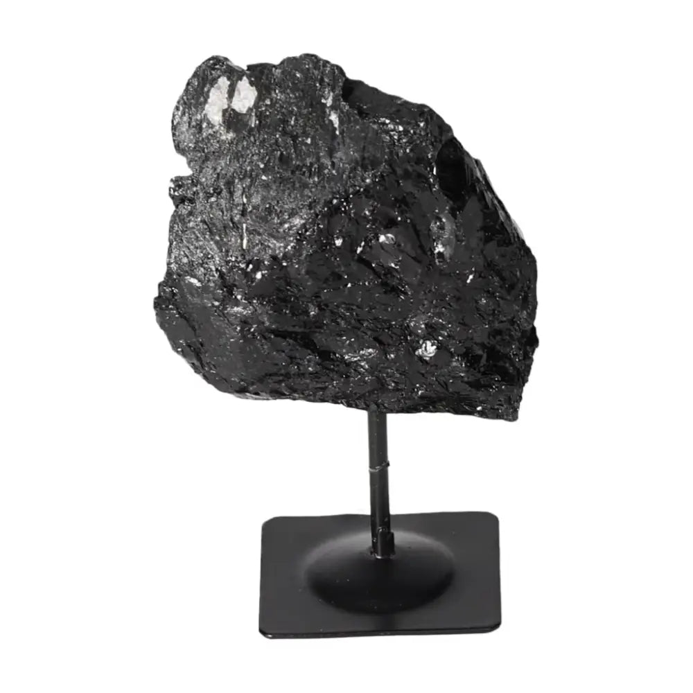 Rough Black Tourmaline on Metal Stand by Sylvia Crystals, perfect for décor and energy cleansing.