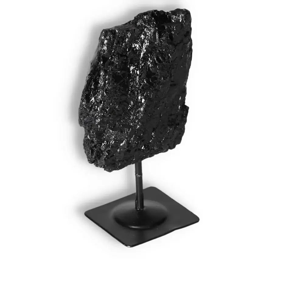 Elegant Rough Black Tourmaline with metal stand, ideal for décor and cleansing negative energies, from Sylvia Crystals.