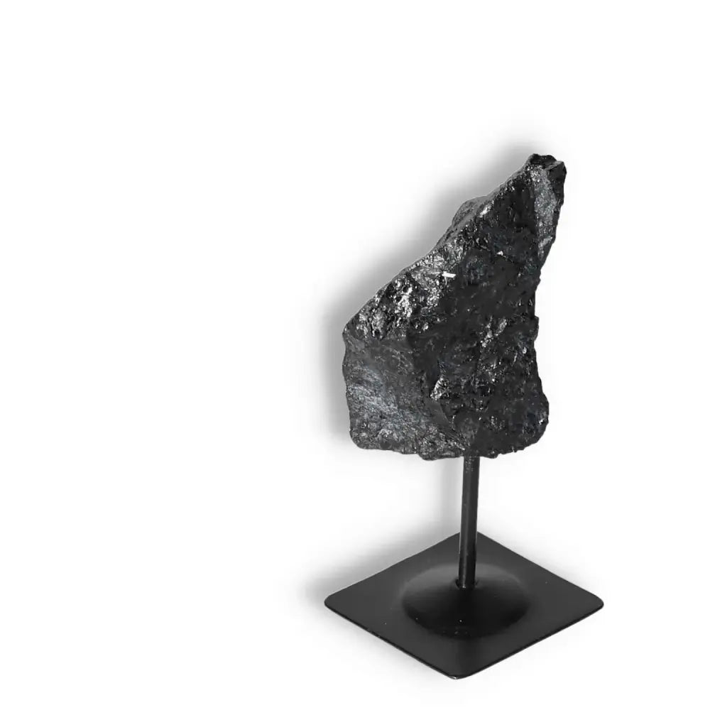 Rough Black Tourmaline with Metal Stand S from Sylvia Crystals, known for cleansing negative energies and providing grounding force.