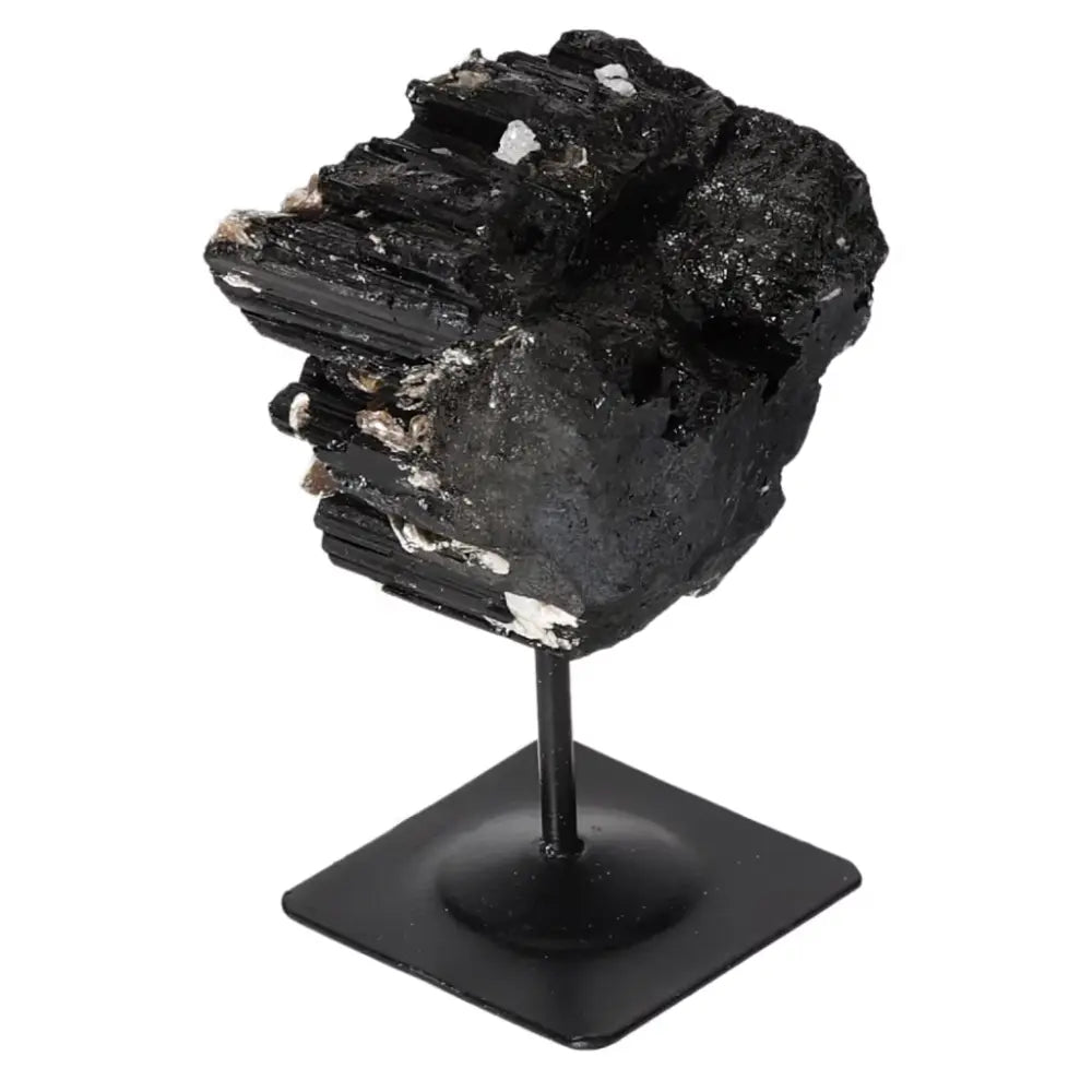 Rough Black Tourmaline on metal stand, luxury spiritual crystal for energy cleansing and grounding by Sylvia Crystals.