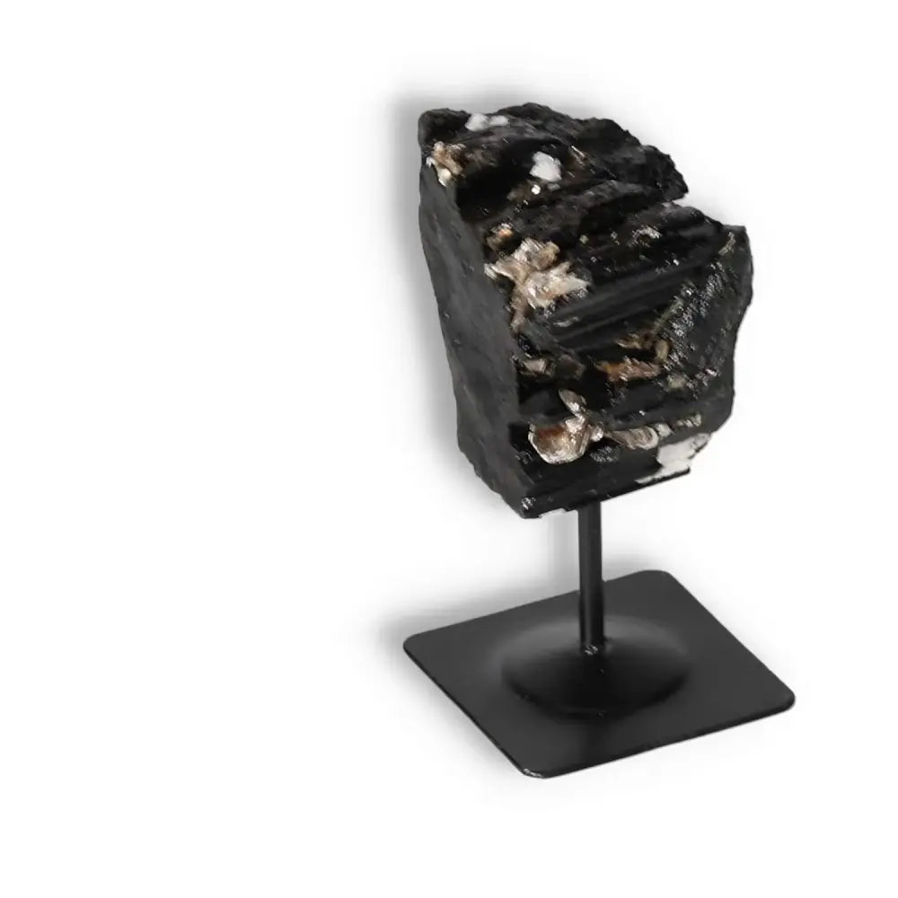 Rough Black Tourmaline on Metal Stand S from Sylvia Crystals, known for energy cleansing and spiritual grounding.