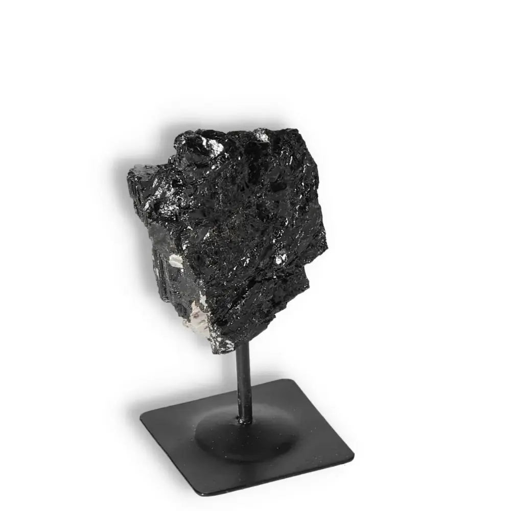 Rough Black Tourmaline crystal with metal stand from Sylvia Crystals, known for energy cleansing and premium quality.