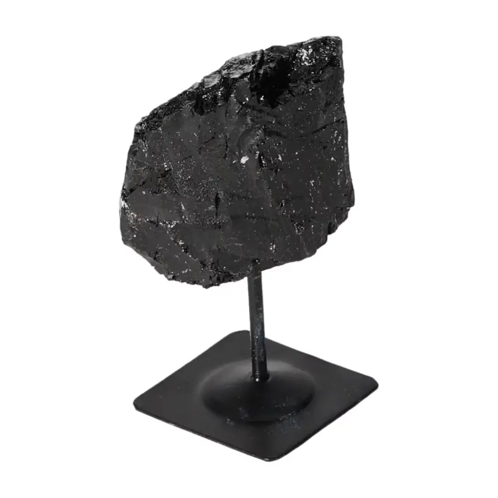 Rough Black Tourmaline with Metal Stand S, a grounding crystal by Sylvia Crystals, ideal for cleansing and energy transformation.
