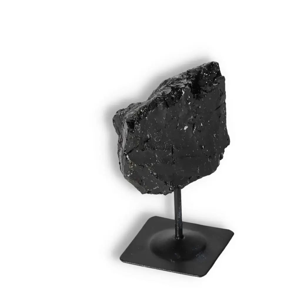 Rough Black Tourmaline on Metal Stand S by Sylvia Crystals, a premium stone for cleansing and grounding, ensuring quality and authenticity.
