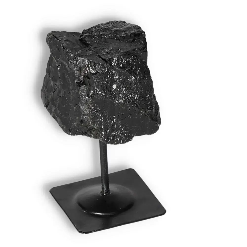 Rough Black Tourmaline on Metal Stand S from Sylvia Crystals, known for cleansing negative energy and enhancing mental stability.
