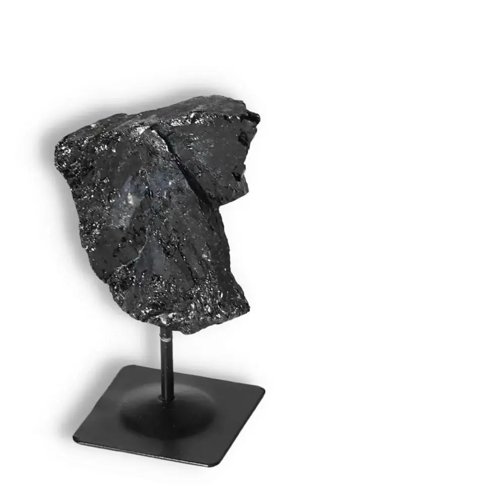 Rough Black Tourmaline on Metal Stand S, a cleansing and healing crystal from Sylvia Crystals, ideal for grounding and energy protection.