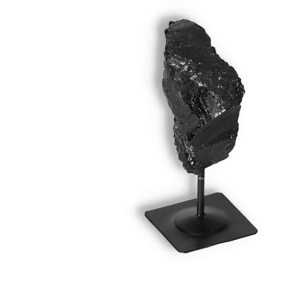Rough Black Tourmaline with Metal Stand S for energy cleansing and grounding by Sylvia Crystals. Enhances concentration and healing.
