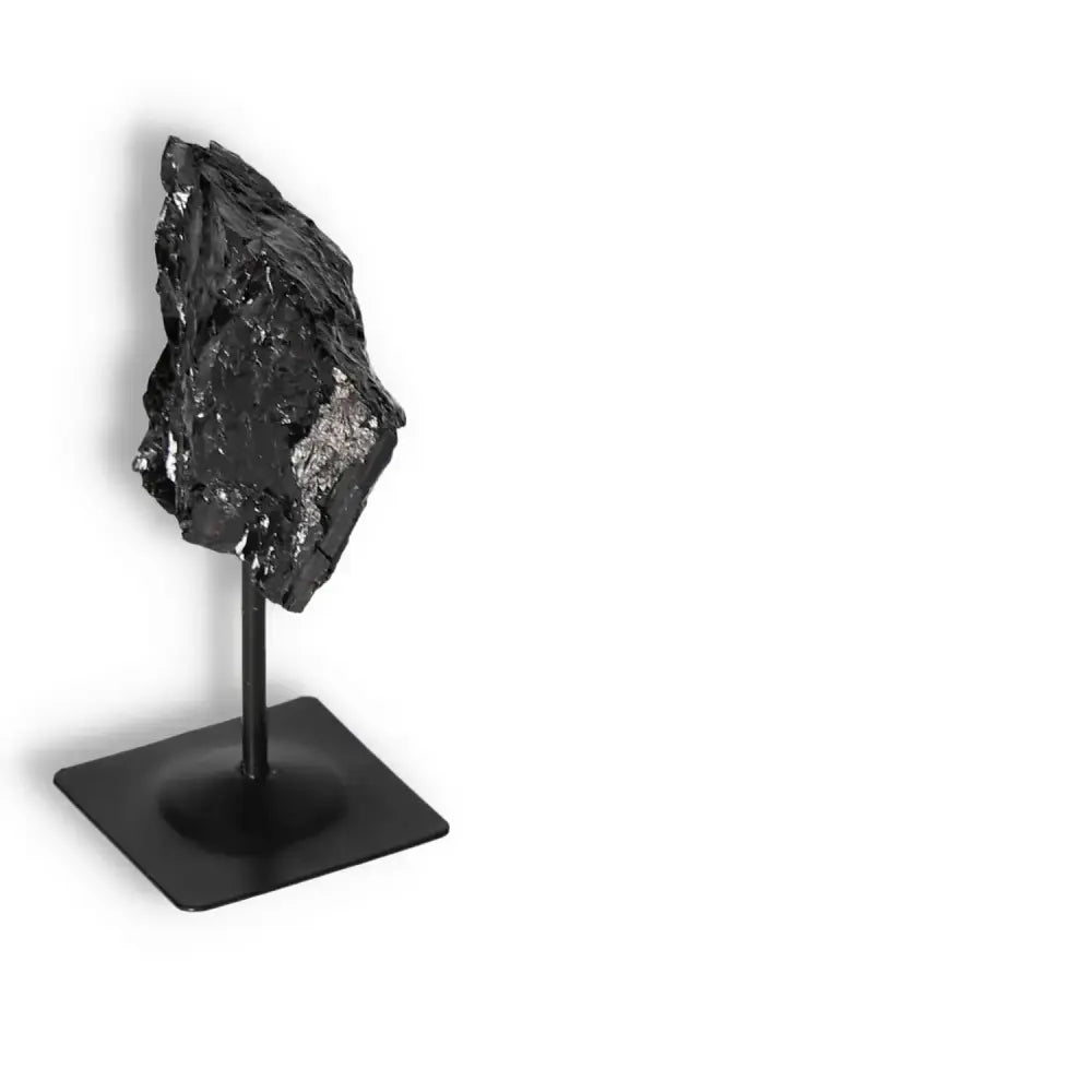 Rough Black Tourmaline with Metal Stand S, symbolizing cleansing energy, enhancing concentration, from Sylvia Crystals.