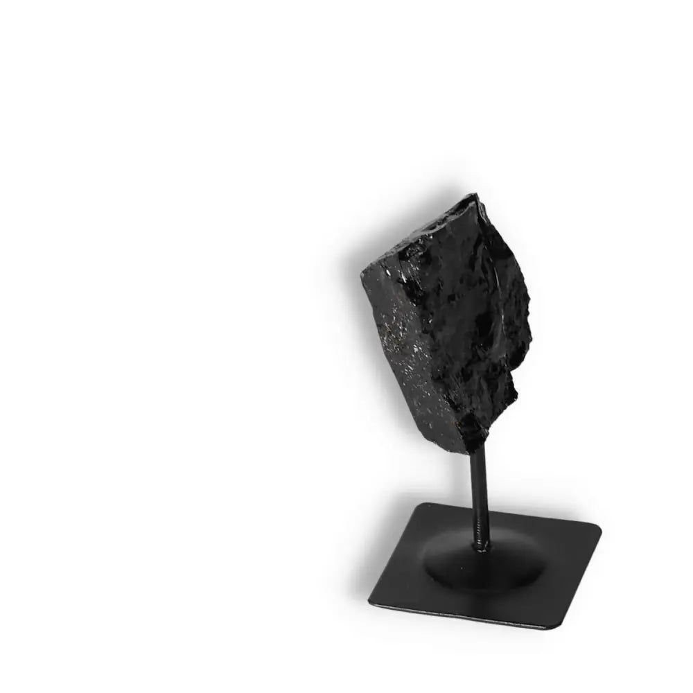 Rough Black Tourmaline with Metal Stand S, a powerful cleansing crystal enhancing concentration, from Sylvia Crystals.