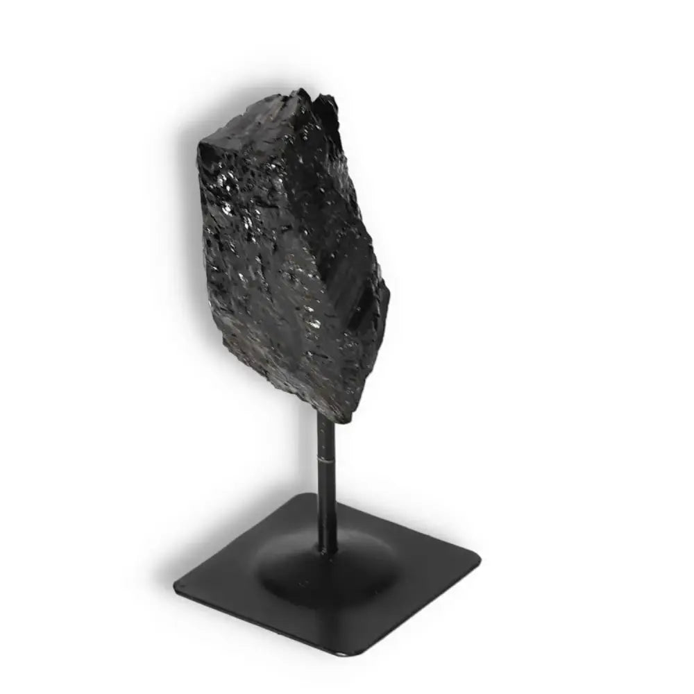 Rough Black Tourmaline with Metal Stand S, a healing crystal by Sylvia Crystals for dissipating negative energy and boosting decor.
