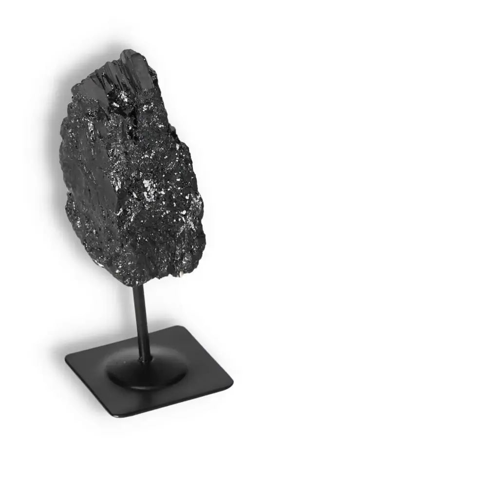 Rough Black Tourmaline on metal stand, ideal for energy cleansing and decor, premium quality from Sylvia Crystals.