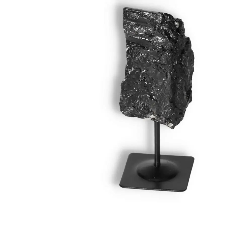 Rough Black Tourmaline on Metal Stand S from Sylvia Crystals, perfect for energy cleansing and decor.
