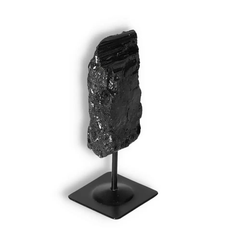 Rough Black Tourmaline on Metal Stand by Sylvia Crystals, known for cleansing negative energies, premium quality crystal.