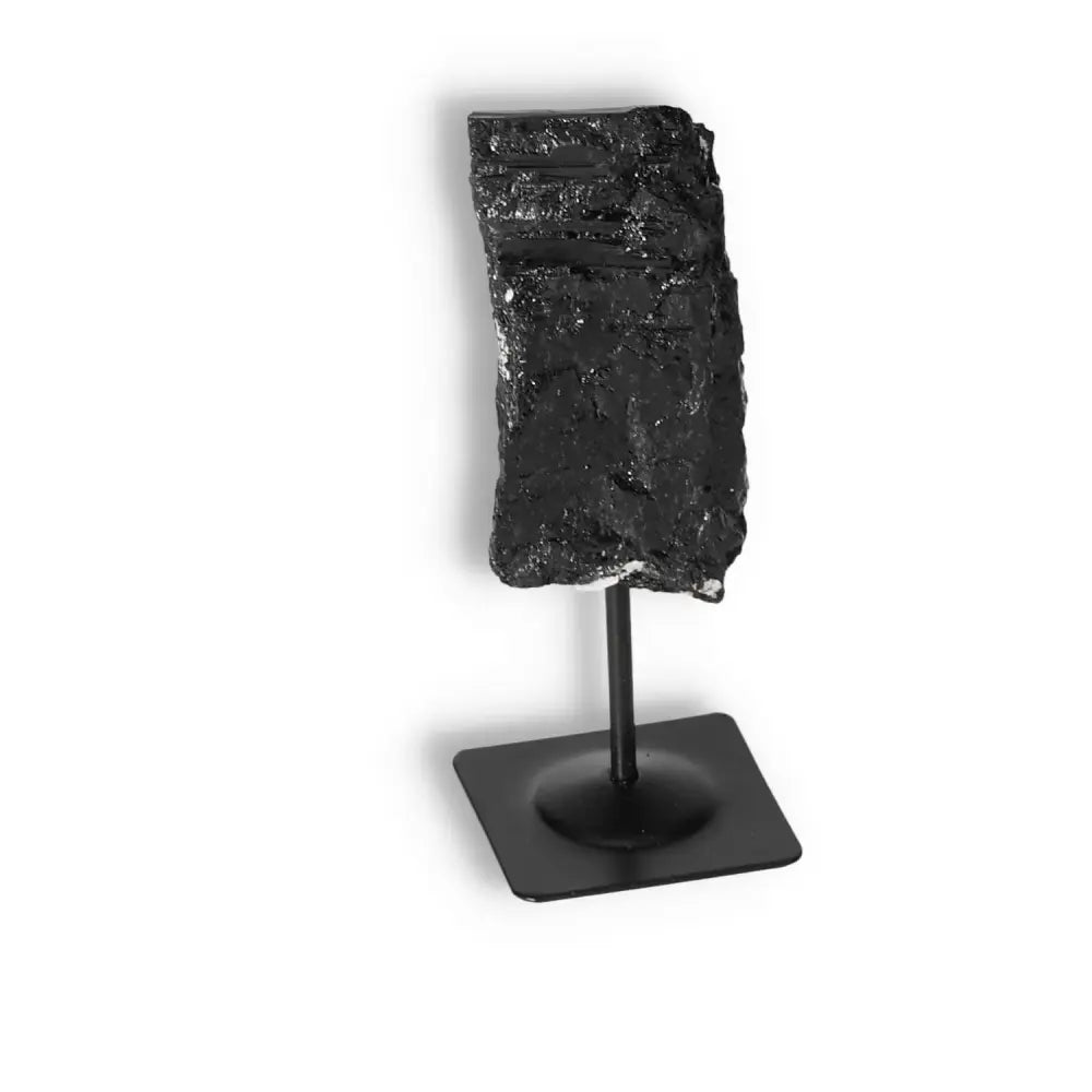 Rough Black Tourmaline on Metal Stand by Sylvia Crystals, ideal for energy cleansing and negative energy transformation.