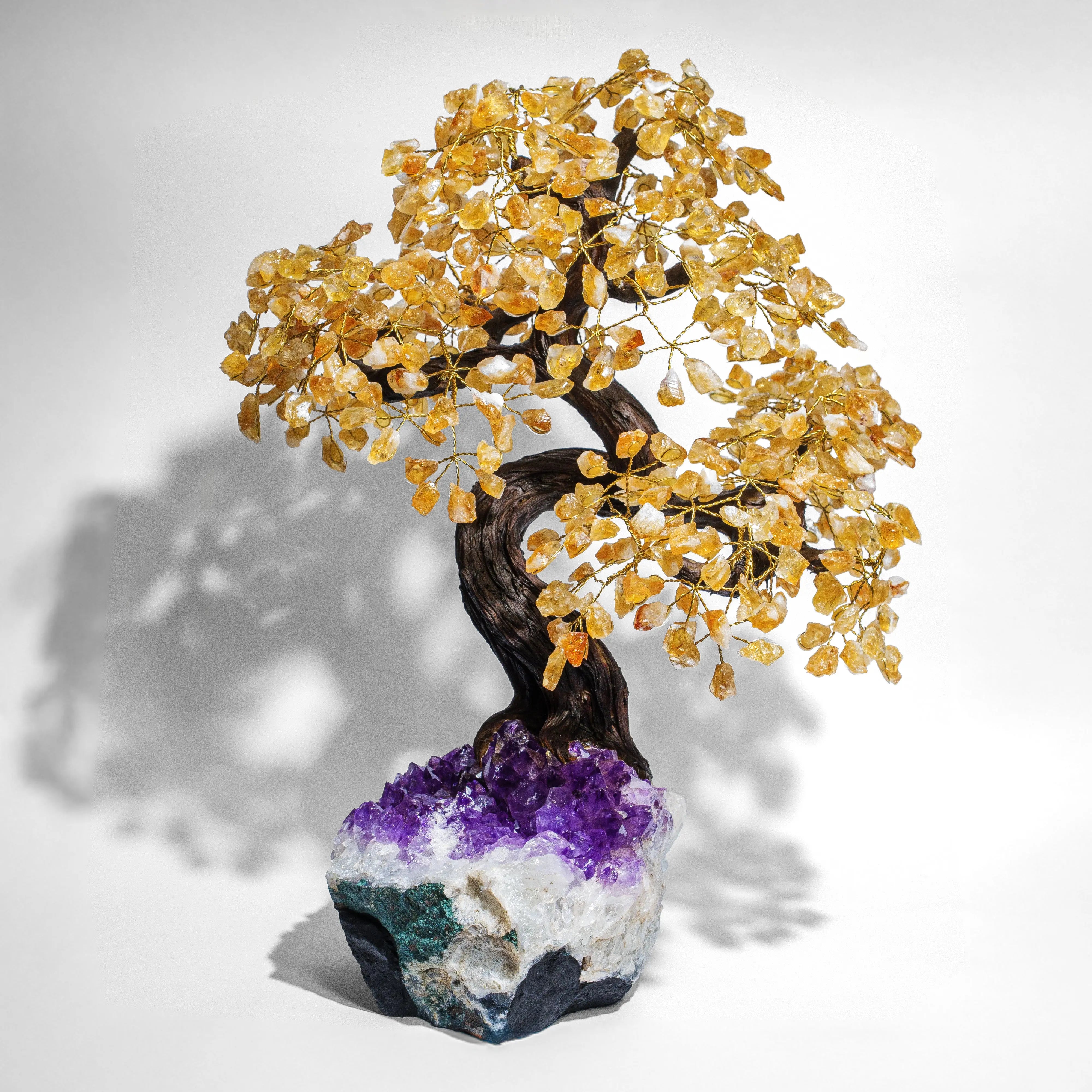 Handcrafted 55cm Citrine Crystal Bonsai Tree for prosperity and positivity with genuine citrine gemstones on an amethyst base.