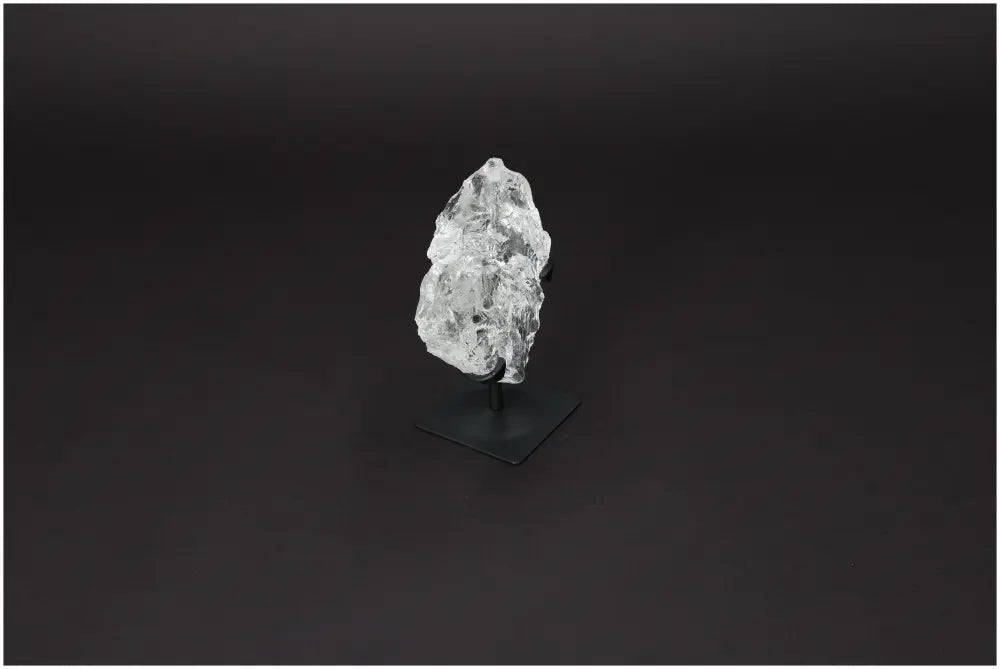 Rough Lemurian Quartz on metal stand, showcasing its healing and decorative properties from Sylvia Crystals collection.