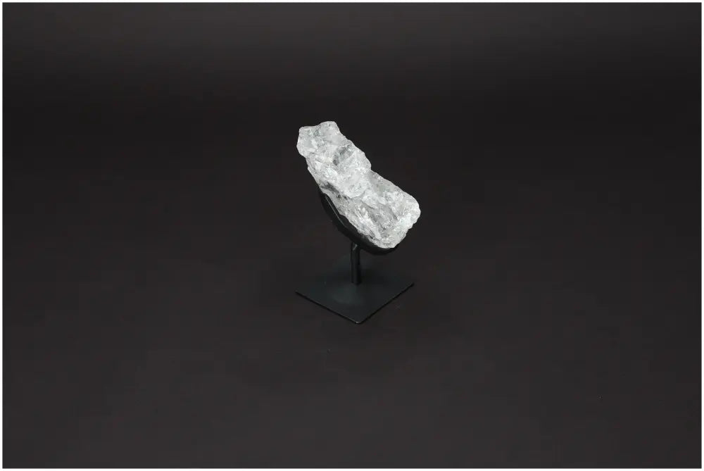 Rough Lemurian Quartz on metal stand, enhances well-being and decor, from Sylvia Crystals with purification properties.