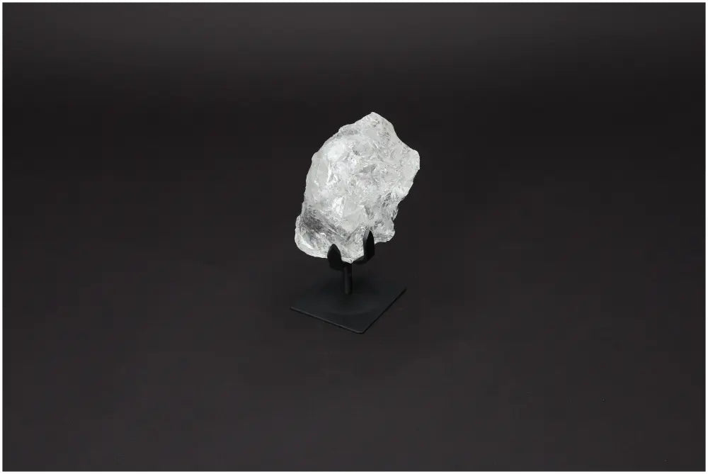 Rough Lemurian Quartz on a sleek metal stand, showcasing natural beauty and luxury from Sylvia Crystals.