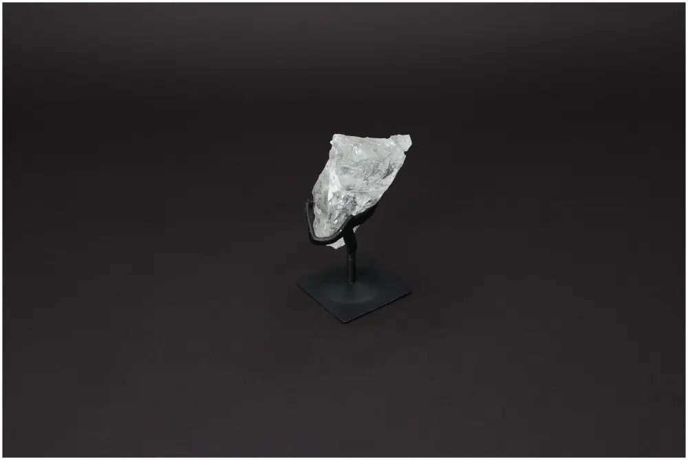 Rough Lemurian Clear Quartz on metal stand, premium crystal from Sylvia Crystals, showcasing elegant purification properties.