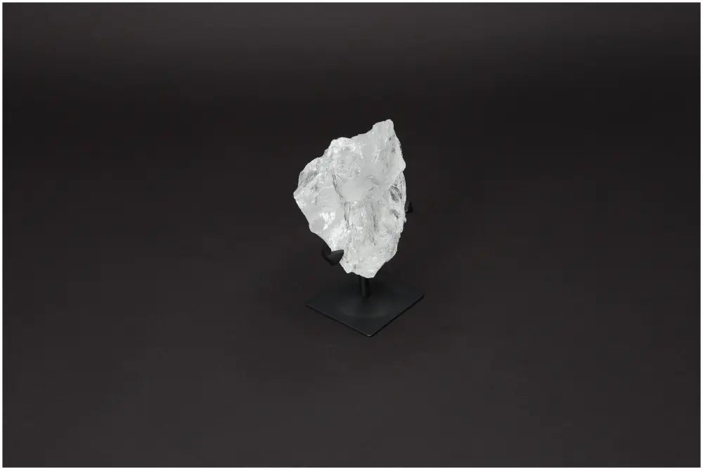 Rough Lemurian Quartz on Metal Stand by Sylvia Crystals, enhancing spaces with elegance and purity, ideal for conscious living.