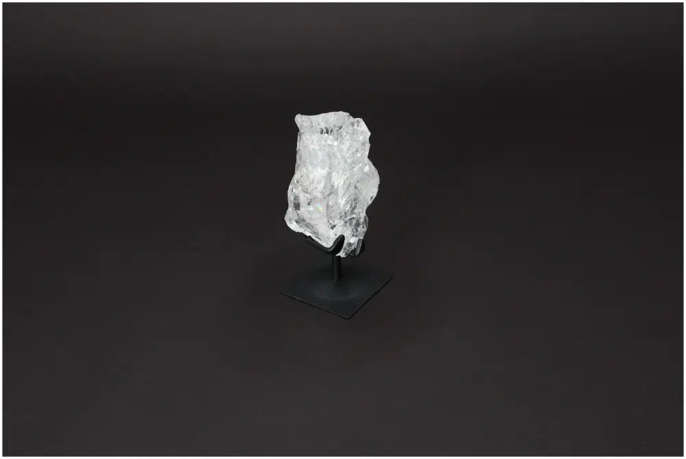 Rough Lemurian Quartz on elegant metal stand, showcasing natural beauty and elegance. Premium piece from Sylvia Crystals.