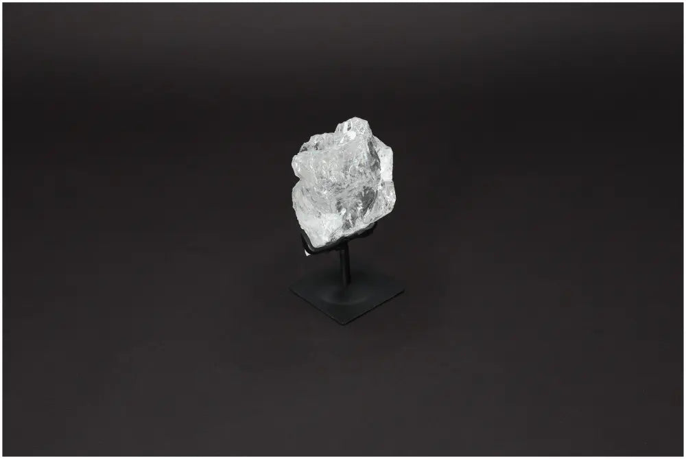 Rough Lemurian Quartz on elegant metal stand from Sylvia Crystals, showcasing natural allure and spiritual purity.