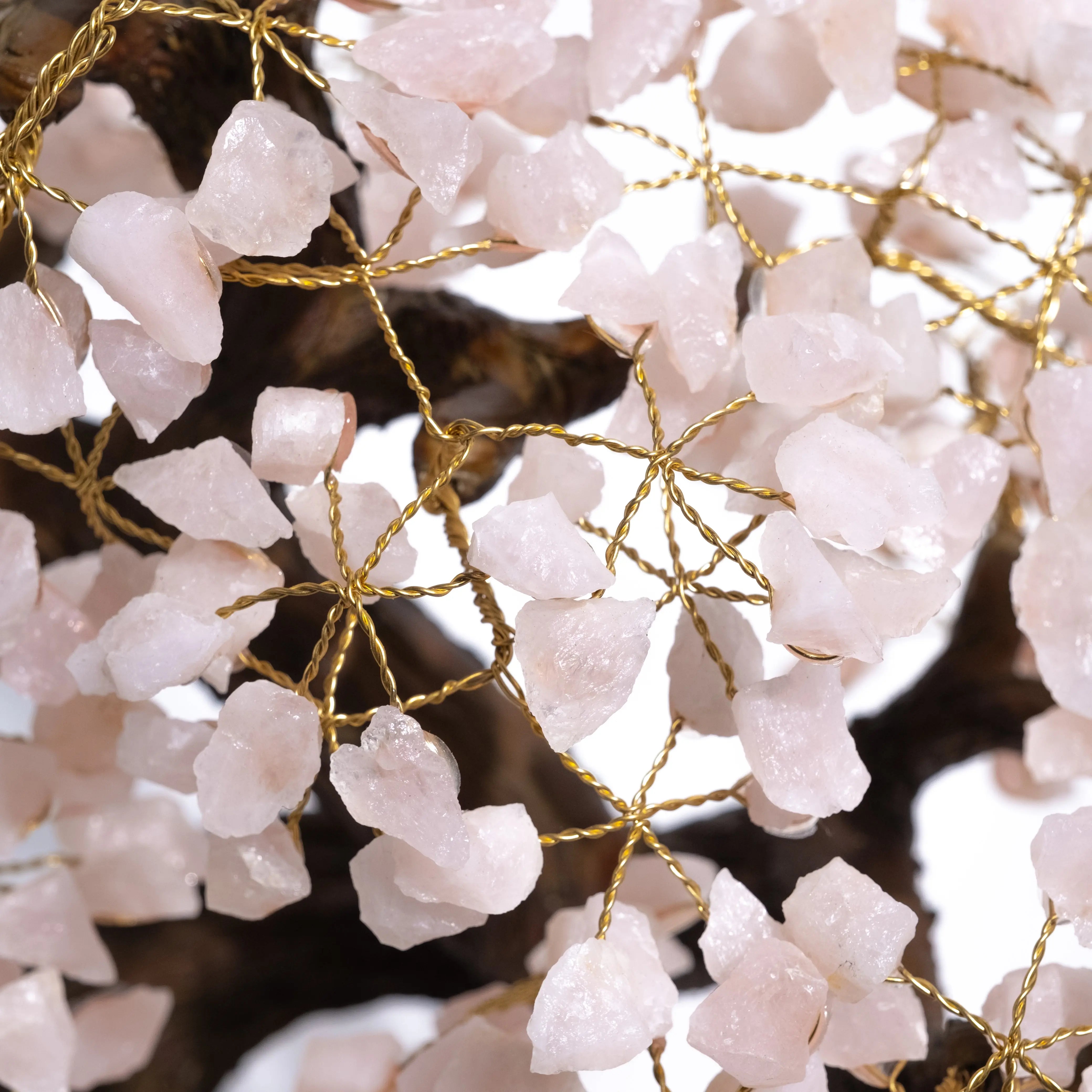 Close-up of Rough Quartz Tree, showing delicate quartz crystals and gold wire craftsmanship.