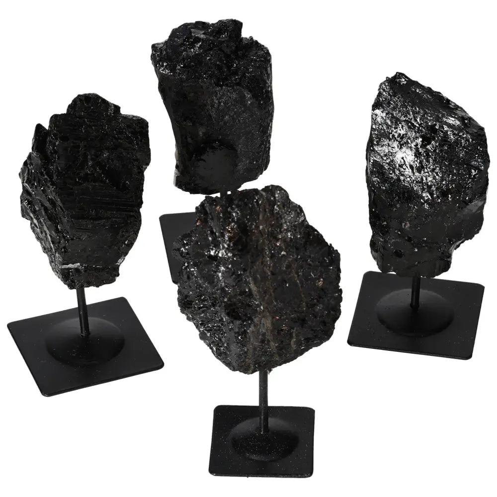 Rough Tourmaline crystals on metal stands in varying textures, showcasing natural elegance and vibrant colors for home decor by Sylvia Crystals.