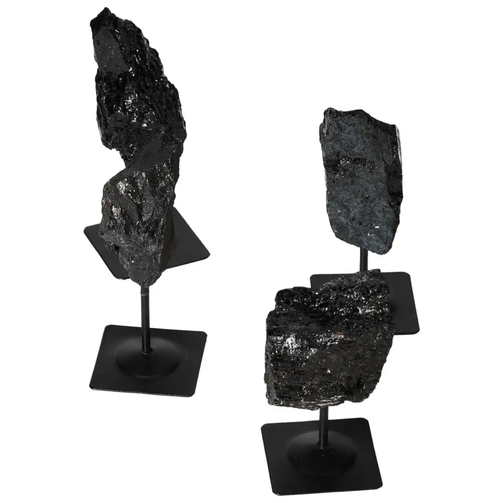 Rough Tourmaline on Metal Stand showcasing deep blacks and greens, symbolizing luxury and spiritual harmony, by Sylvia Crystals.