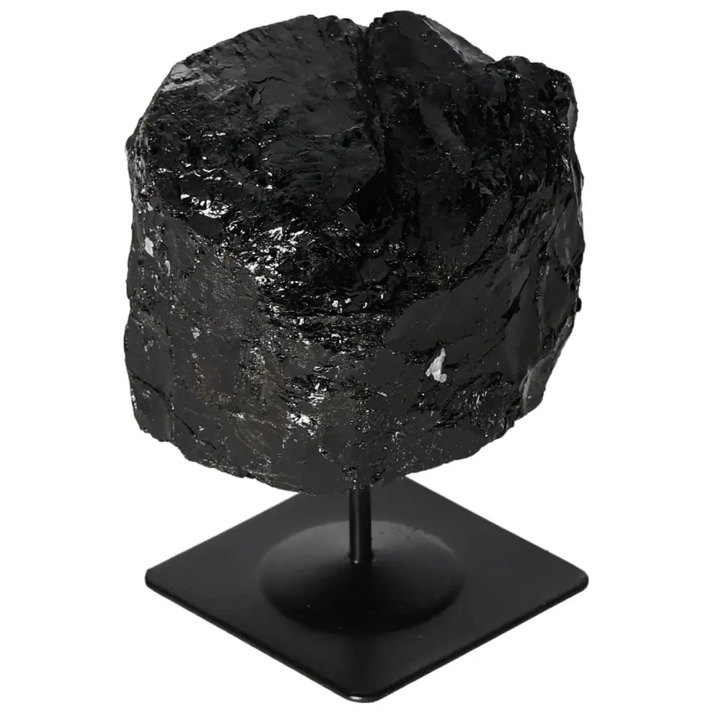 Rough black tourmaline crystal on metal stand; premium Sylvia Crystals piece showcasing natural beauty and vibrant hues.