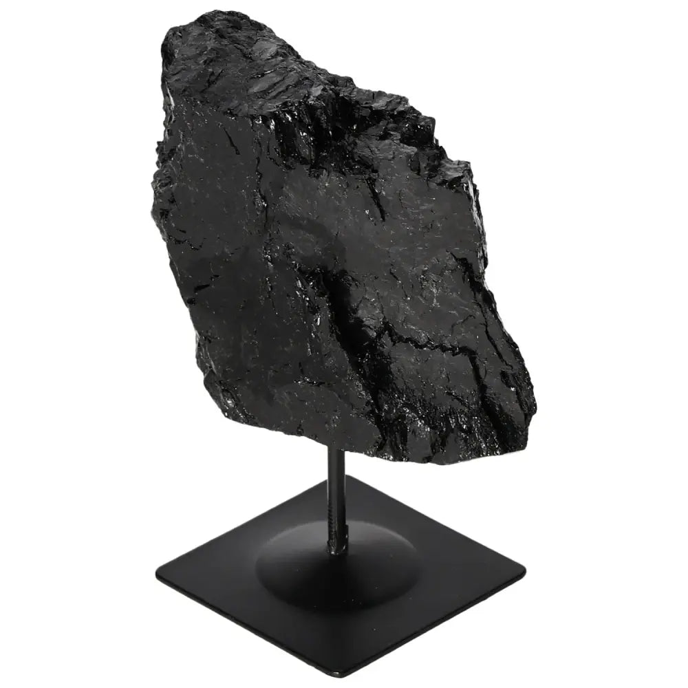 Rough tourmaline crystal on metal stand, luxurious and energy-balancing centerpiece by Sylvia Crystals.