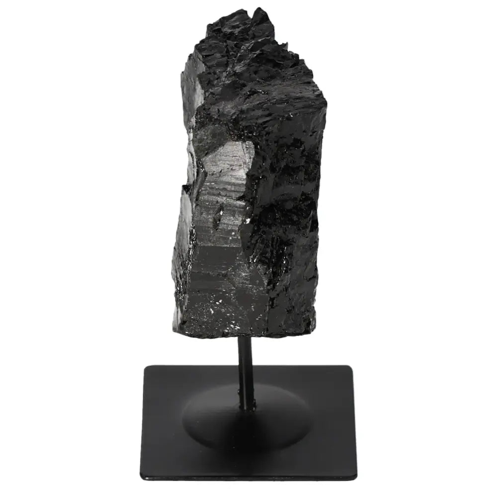 Rough Tourmaline on a sleek metal stand, showcasing vibrant colors and energy-balancing properties for home decor and spiritual harmony.