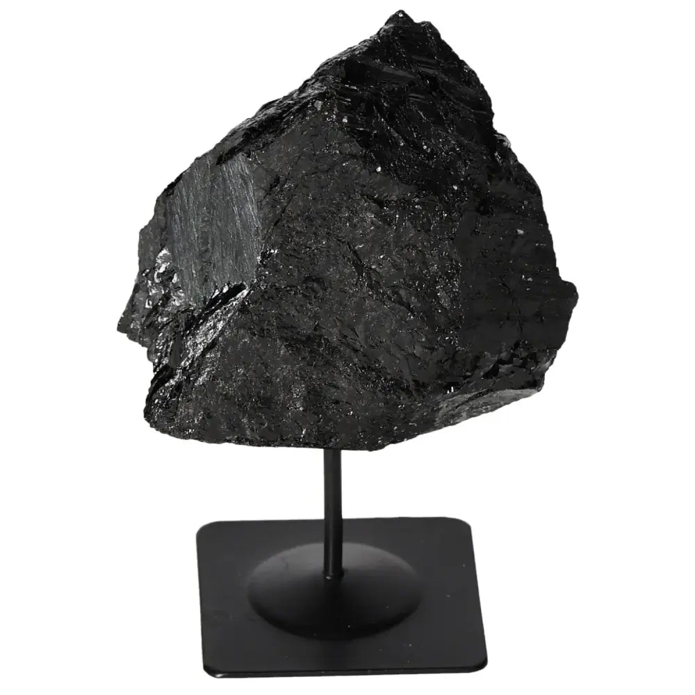 Rough Tourmaline gemstone on sleek metal stand, premium Sylvia Crystals product, elegant decor piece exemplifying nature's beauty.