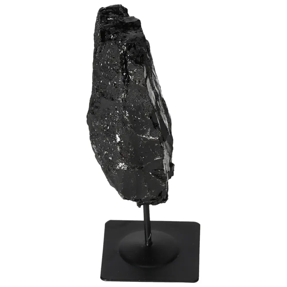 Premium rough tourmaline crystal on a metal stand showcasing dark, lustrous textures, perfect for energy harmonizing and decor.