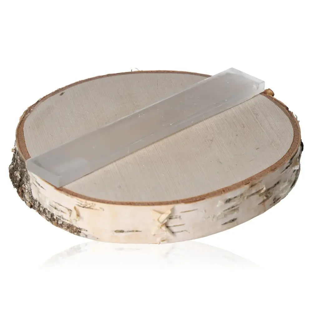 Selenite free form polished on a wooden base, showcasing its glass-like transparency and natural striations, ideal for peace and harmony.